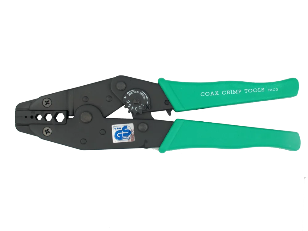 • Tipo carraca.<br> • Para cable coaxial.<br> • Con ajuste de presión y bloqueo.